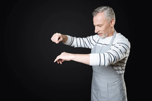 Enigmatical retiree while preparing dinner — Stock Photo, Image