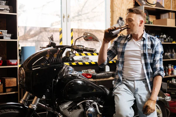 Capable man having some beer in the evening — Stock Photo, Image