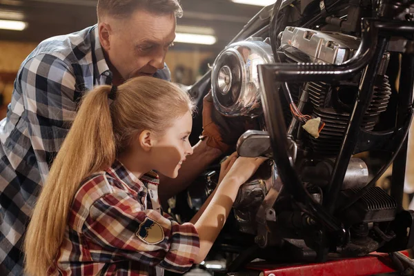 Productive passionate kid happy to help her dad — Stock Photo, Image