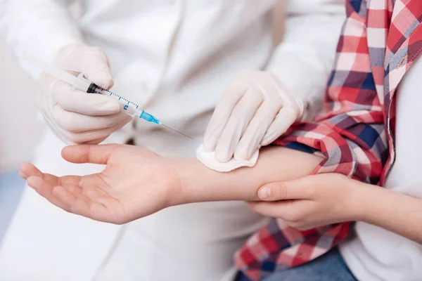 Close up of child hand vaccinating against diseases — Stock Photo, Image