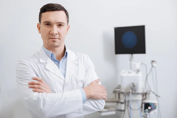 Confident doctor looking straight at camera — Stock Photo, Image