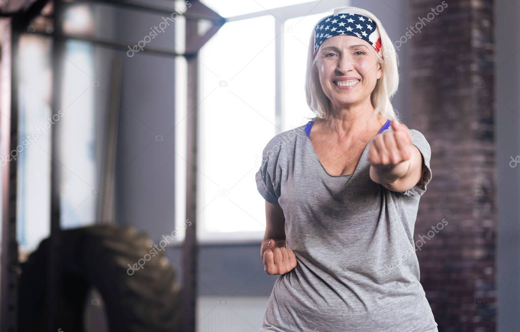 Happy active woman practicing self defence