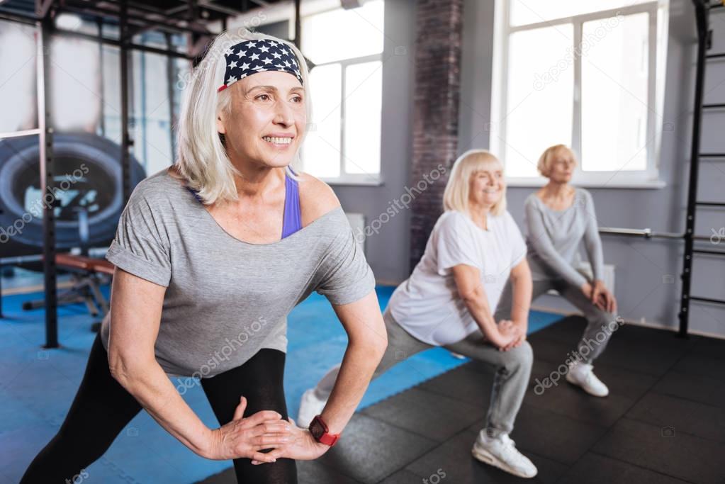 Cheerful nice women visiting aerobic classes