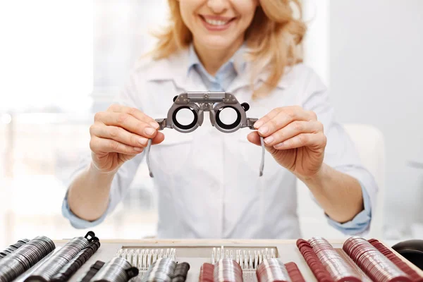 Talented skillful optician offering trial spectacles — Stock Photo, Image