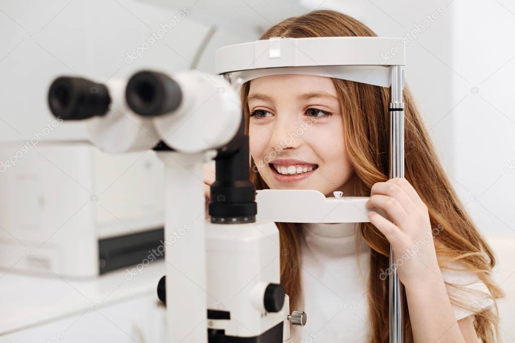 Adorable girl getting her eyes checked