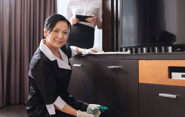 Pleasant Asian woman working in a hotel