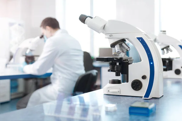 Modern microscope standing on the table — Stock Photo, Image