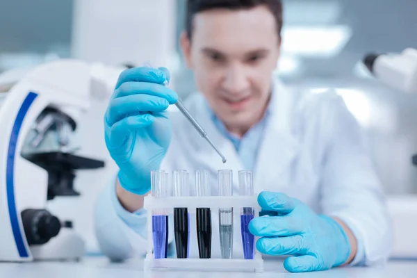 Close up of support being filled with test glasses — Stock Photo, Image