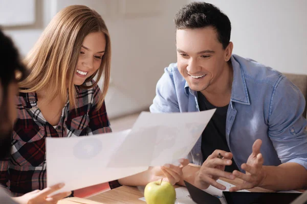 Positive delighted couple reading results — Stock Photo, Image