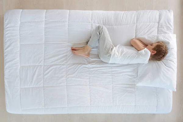 Pleasant peaceful boy sleeping on the right side — Stock Photo, Image