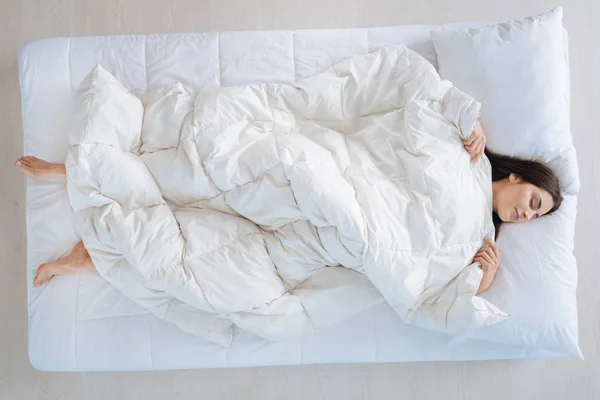 Delighted nice woman lying under the blanket — Stock Photo, Image