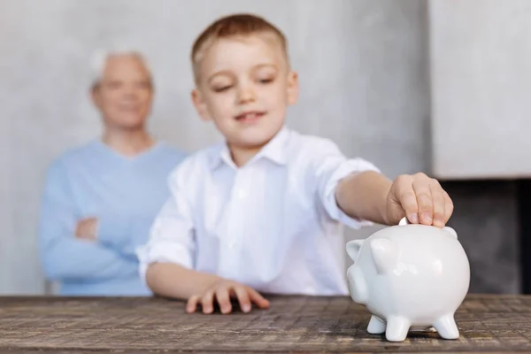 Inspired young kid sparing money for a dream — Stock Photo, Image