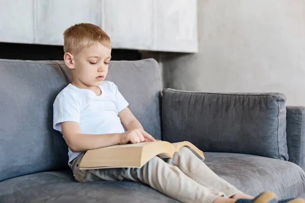 Brilliant amazing creative kid reading a book — Stock Photo, Image