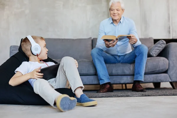 Two men of a family sharing common hobby — Stock Photo, Image