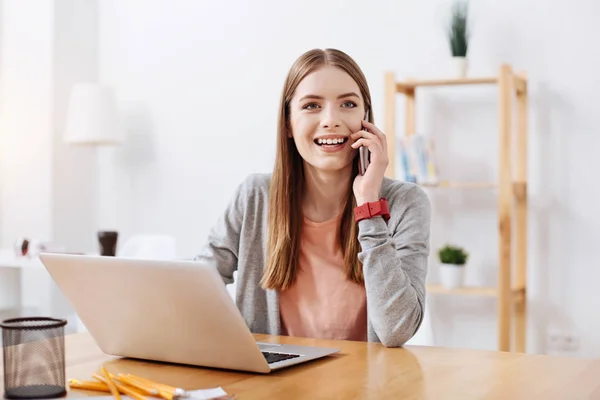 Cheerful bright girl calling her friend — Stock Photo, Image