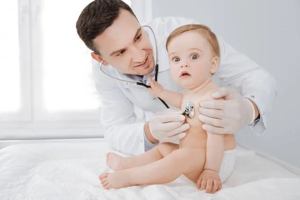 Great doctor making sure his adorable patient being healthy — Stock Photo, Image