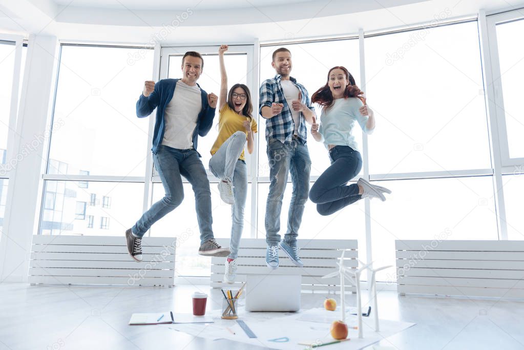Happy nice people making a jump