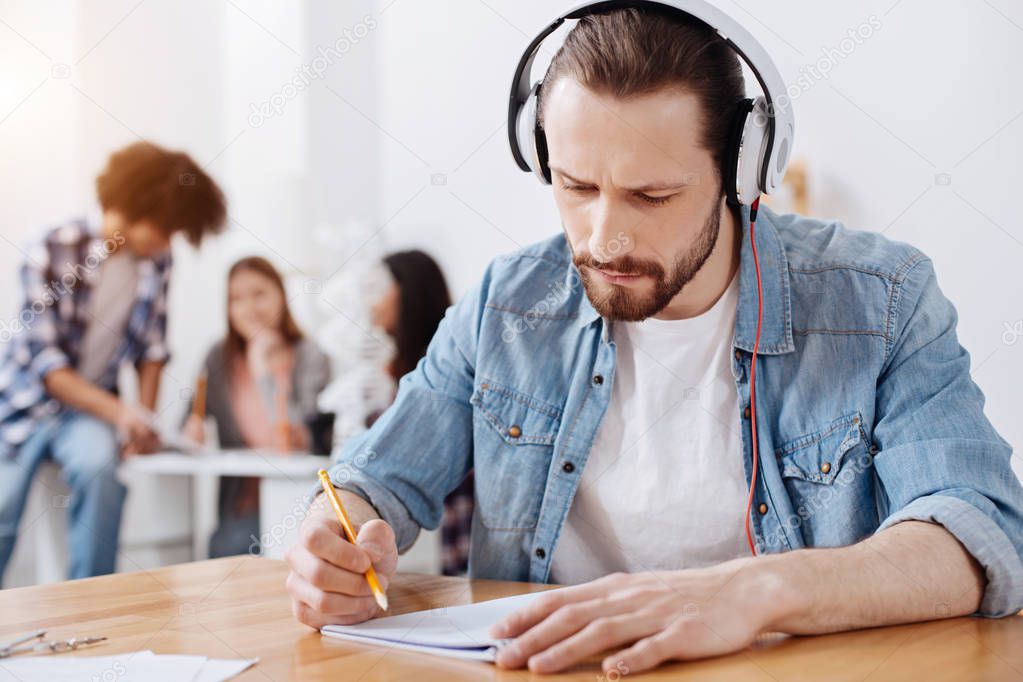 Persistent talented man studying with determination