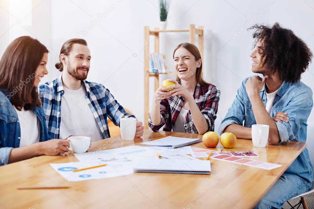 Lively passionate witty people enjoying a group chat