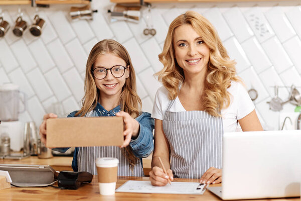 Lovely mother and daughter ready to give an order