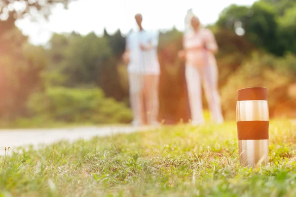 Thermo cup standing in the grass — Stock Photo, Image