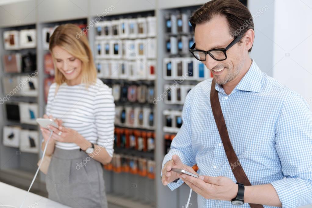 Smiling people buying smartphones at electronics shop — Stock Photo © yacobchuk1 158884816