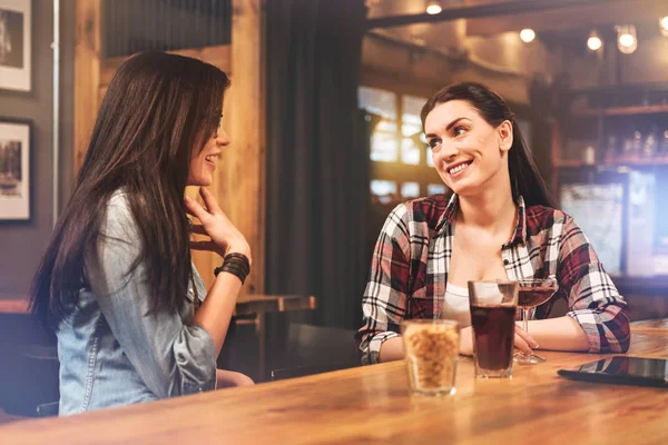 Charming brunette talking to her friend — Stock Photo, Image