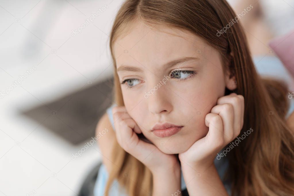 Upset female youngster looking into vacancy