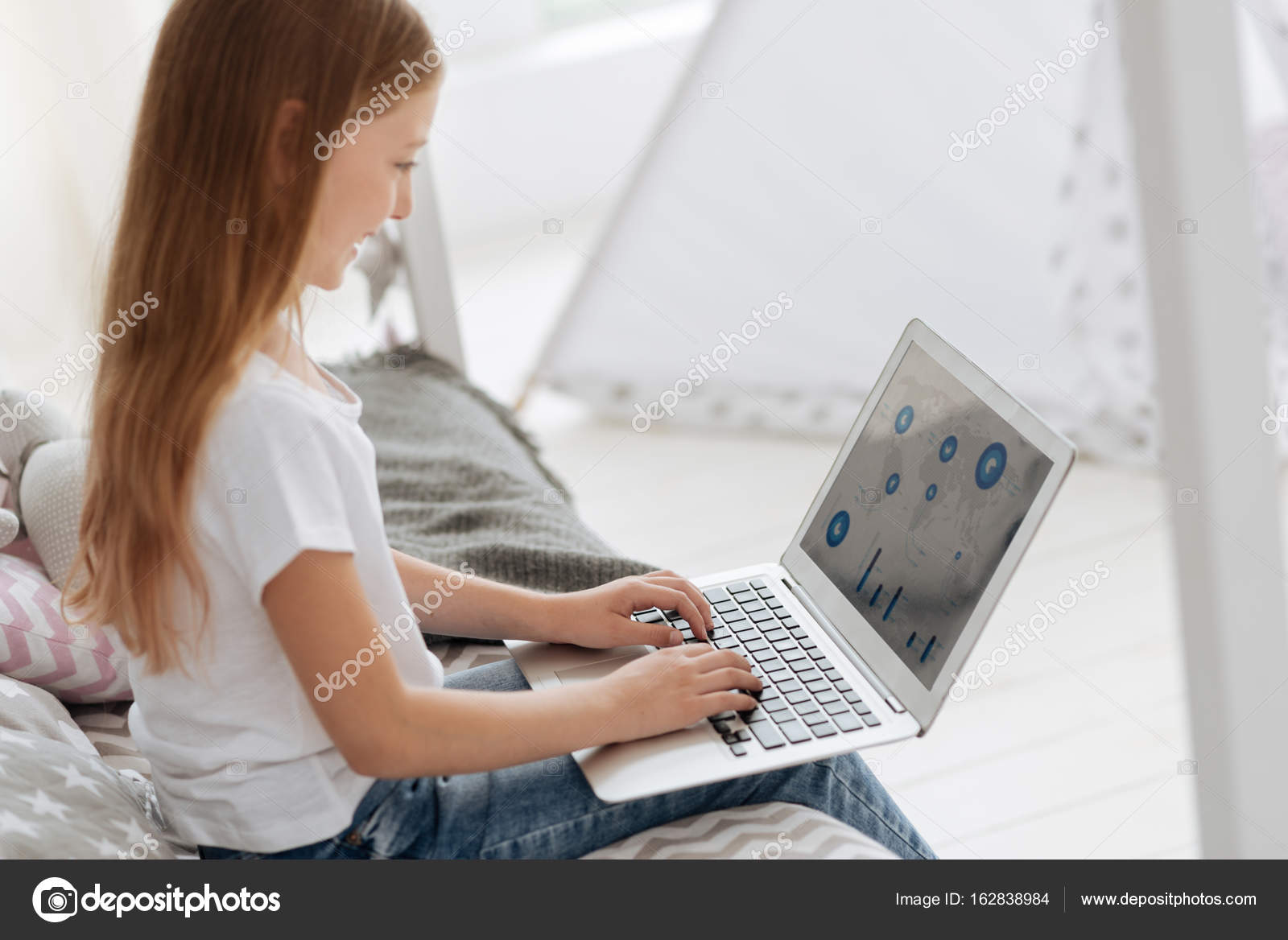 Smart Girl Looking At World Map On Laptop Stock Photo