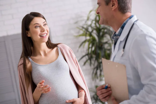 Joyful pregnancy being surprised from her doctor — Stock Photo, Image