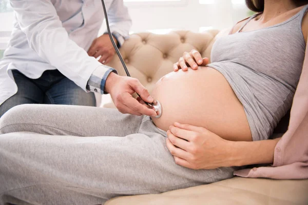 Close up of pregnant female that being at consultation — Stock Photo, Image