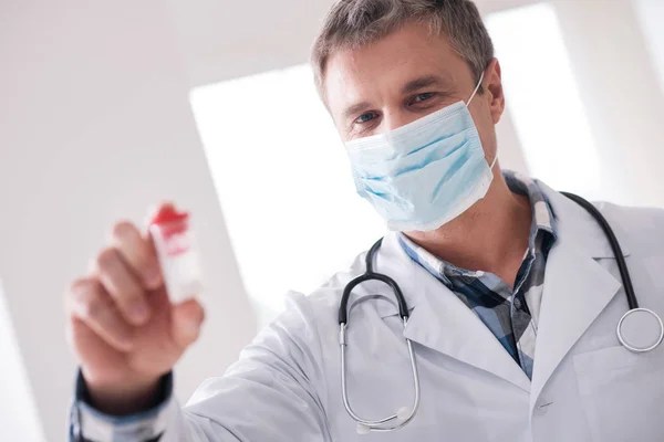 Positive delighted doctor wearing sterile mask — Stock Photo, Image