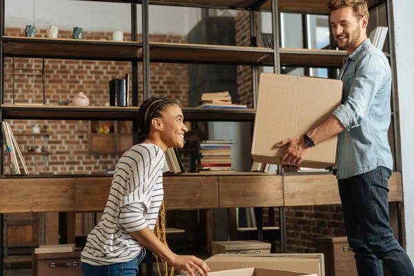 Delighted young couple moving to new house — Stock Photo, Image