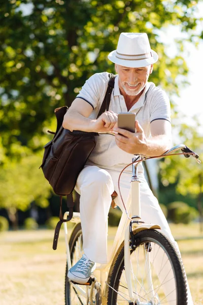Positive male person stopping to have rest — Stock Photo, Image