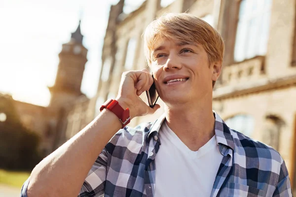 Nice optimistic man receiving good news — Stock Photo, Image