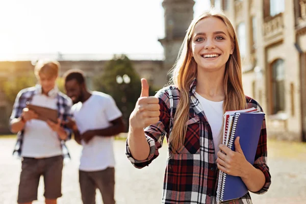 Ambitious pretty woman satisfied with her study — Stock Photo, Image