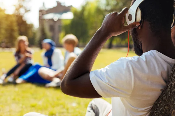 Charismatic creative guy listening to his favorite songs — Stock Photo, Image