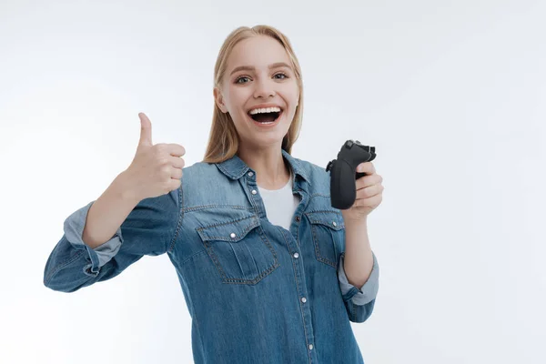 Cheerful blonde showing her thumb — Stock Photo, Image