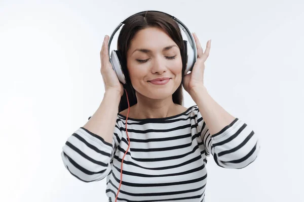 Relaxed female enjoying while listening music — Stock Photo, Image