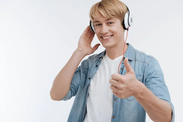 Handsome male person showing that that he is satisfied — Stock Photo, Image