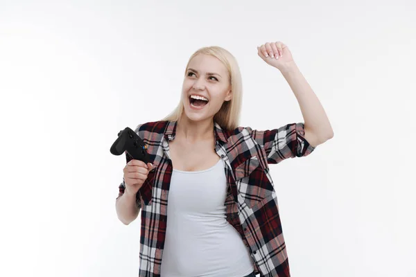 Joyful female raising her left arm up — Stock Photo, Image