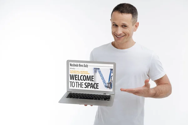 Handsome male demonstrating his website — Stock Photo, Image