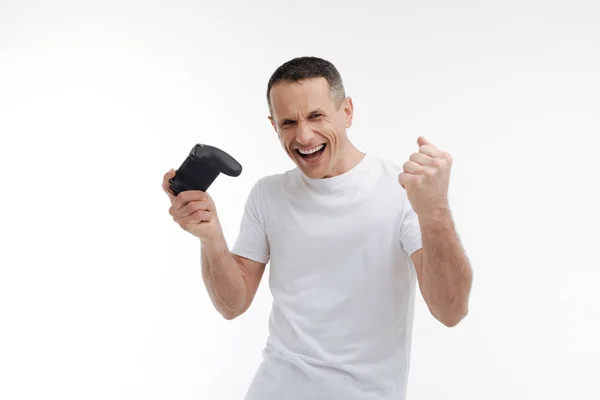 Positive delighted man making fists — Stock Photo, Image