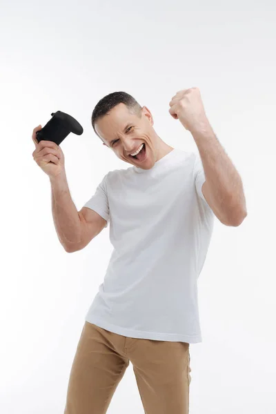 Pleased brunette showing his fists — Stock Photo, Image