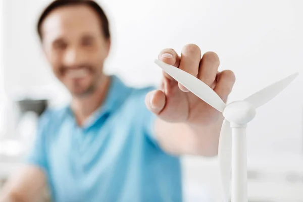 Close up of a male hand touching wind turbine sail — Stock Photo, Image