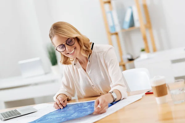 Cheerful architect drawing engineering scheme in the office — Stock Photo, Image
