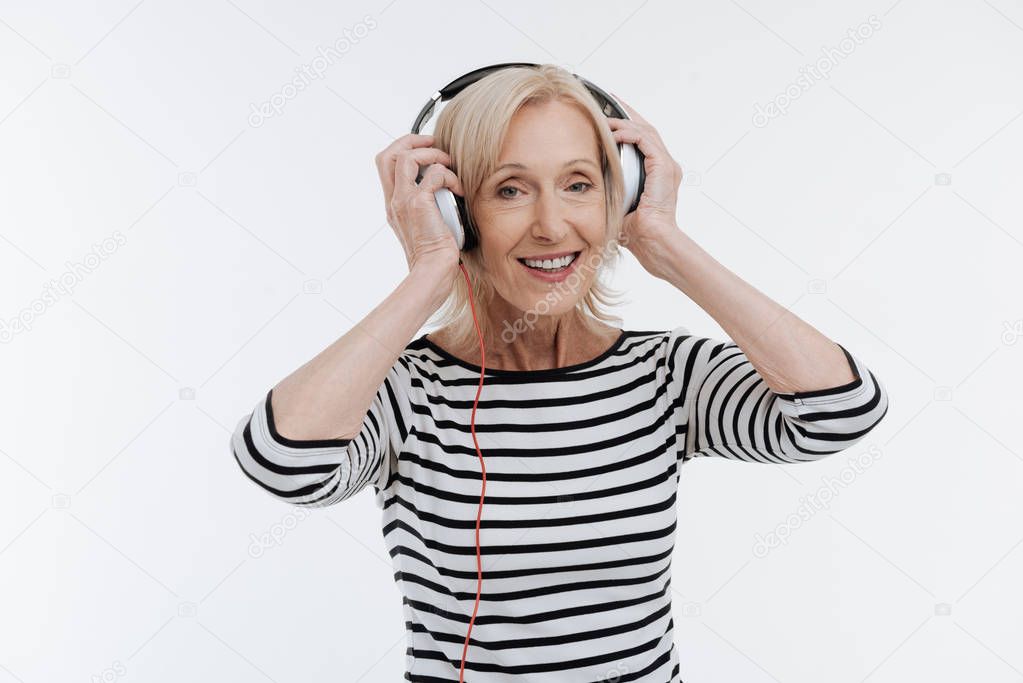 Attractive woman wearing modern headphones