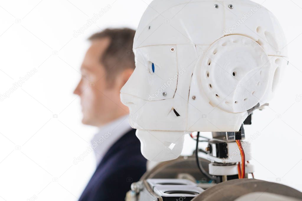 Profile picture of a robot and its prototype