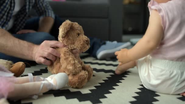 Little baby playing with soft bear at home — Stock Video