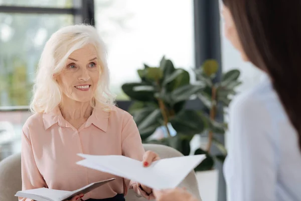 Joyful friendly woman looking at her colleague — Stock Photo, Image